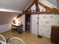 Quiet desk in corner of large room