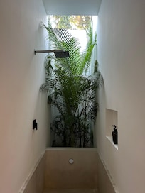 The shower and soaking tub feels like you’re in the jungle