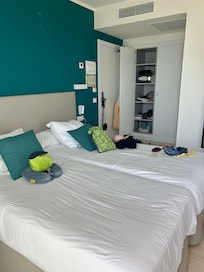 Bedroom and good closet space with hangers and shelves