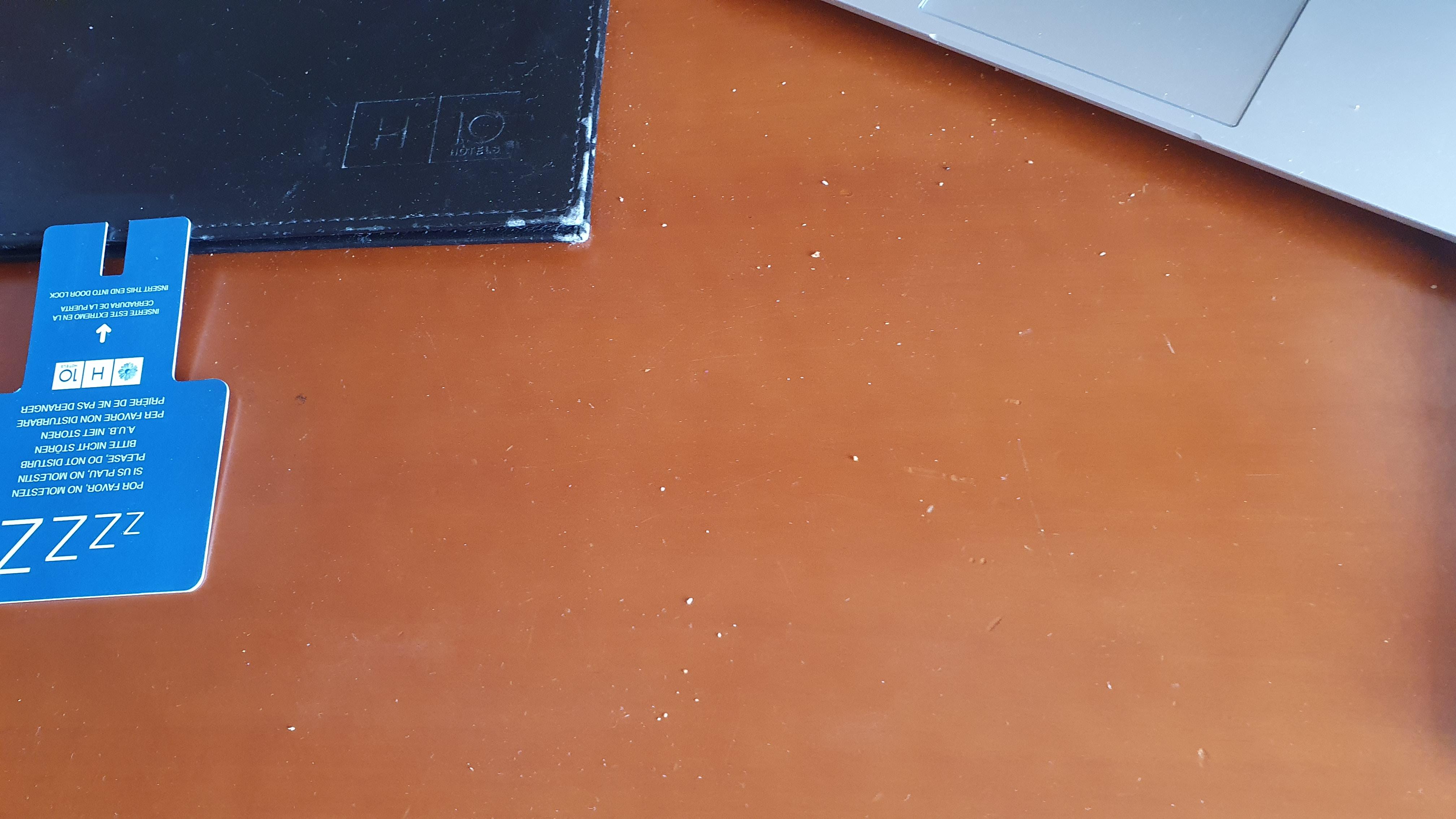 Dust/sand on desk for several days