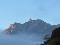 From balcony looking half left zoomed in on a different day when mountains were visible.