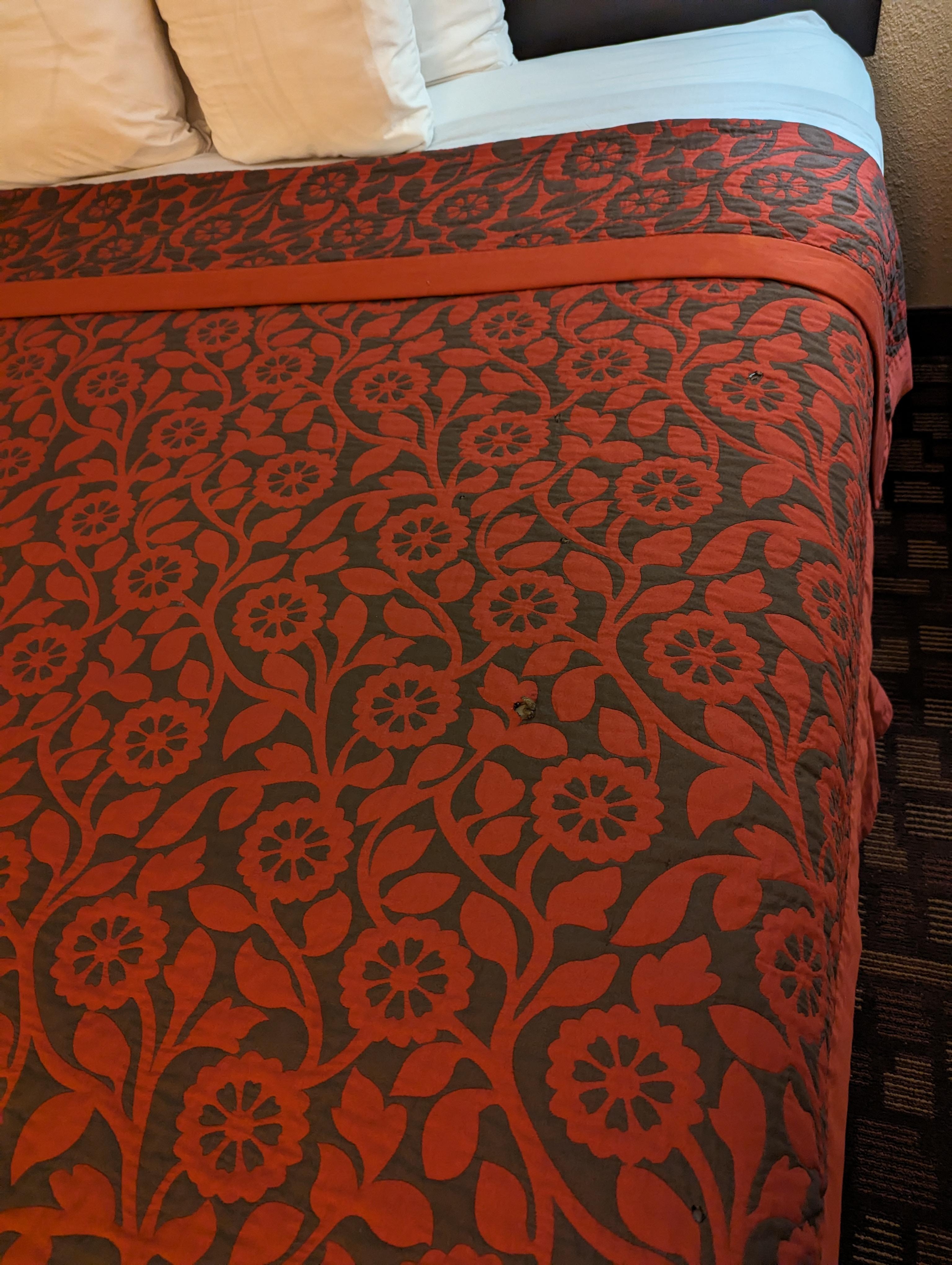 Blanket with cigarette burns.