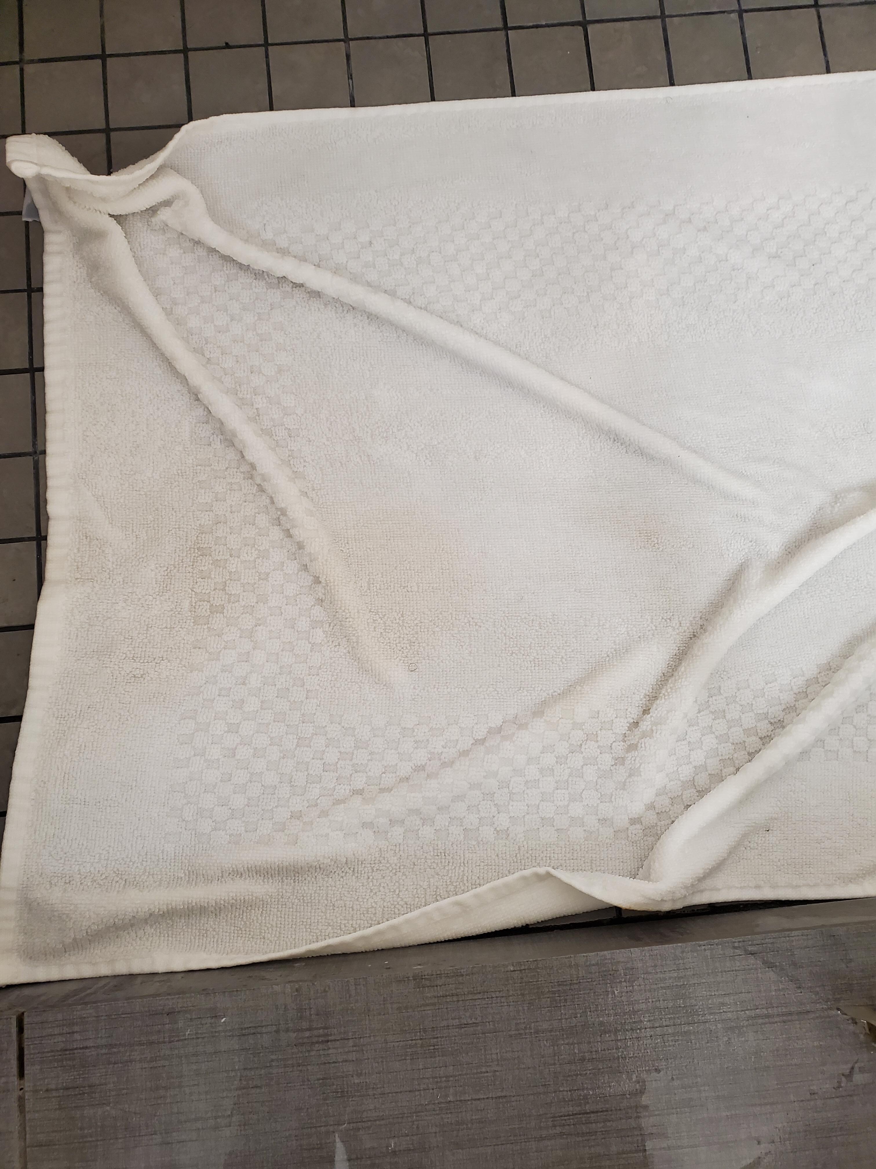 Towel w/ stain placed into circulation to be used