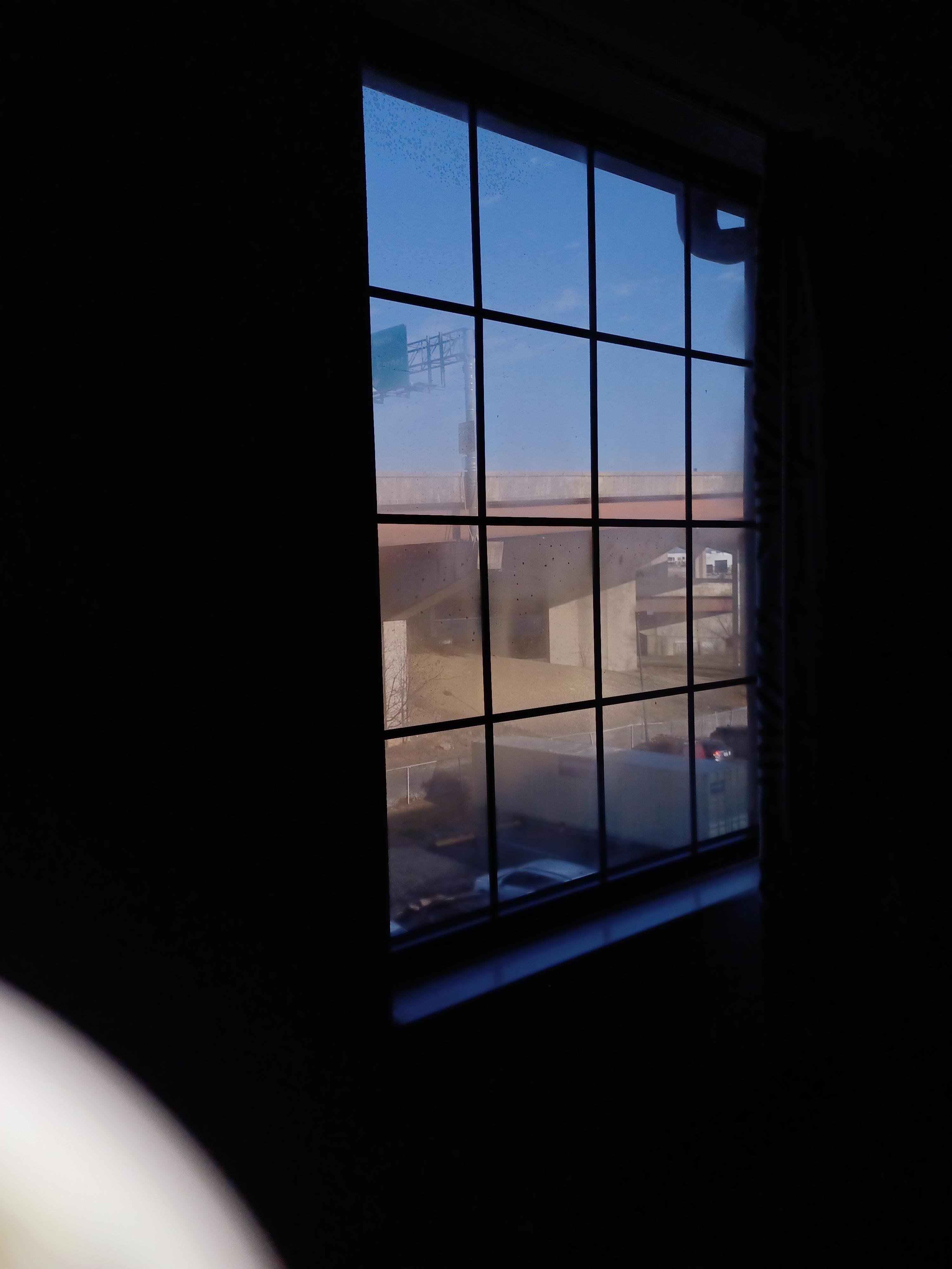 Lighting for pics was weird. View of a bridge behind the parking lot. 