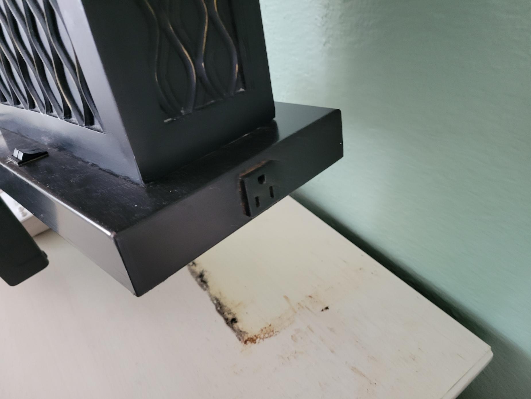 Permanently stained bedside table.