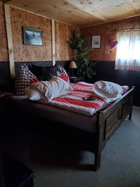 Sweet bedroom with slanted floor, watch out.
