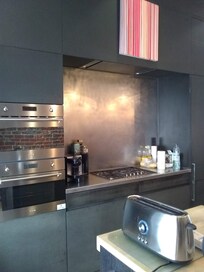 Part of the kitchen: stove, microwave, and oven