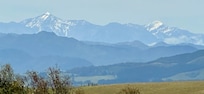 View to the distant snow capped mountains.