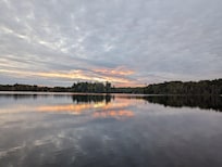 View of the lake at sunset from the beach