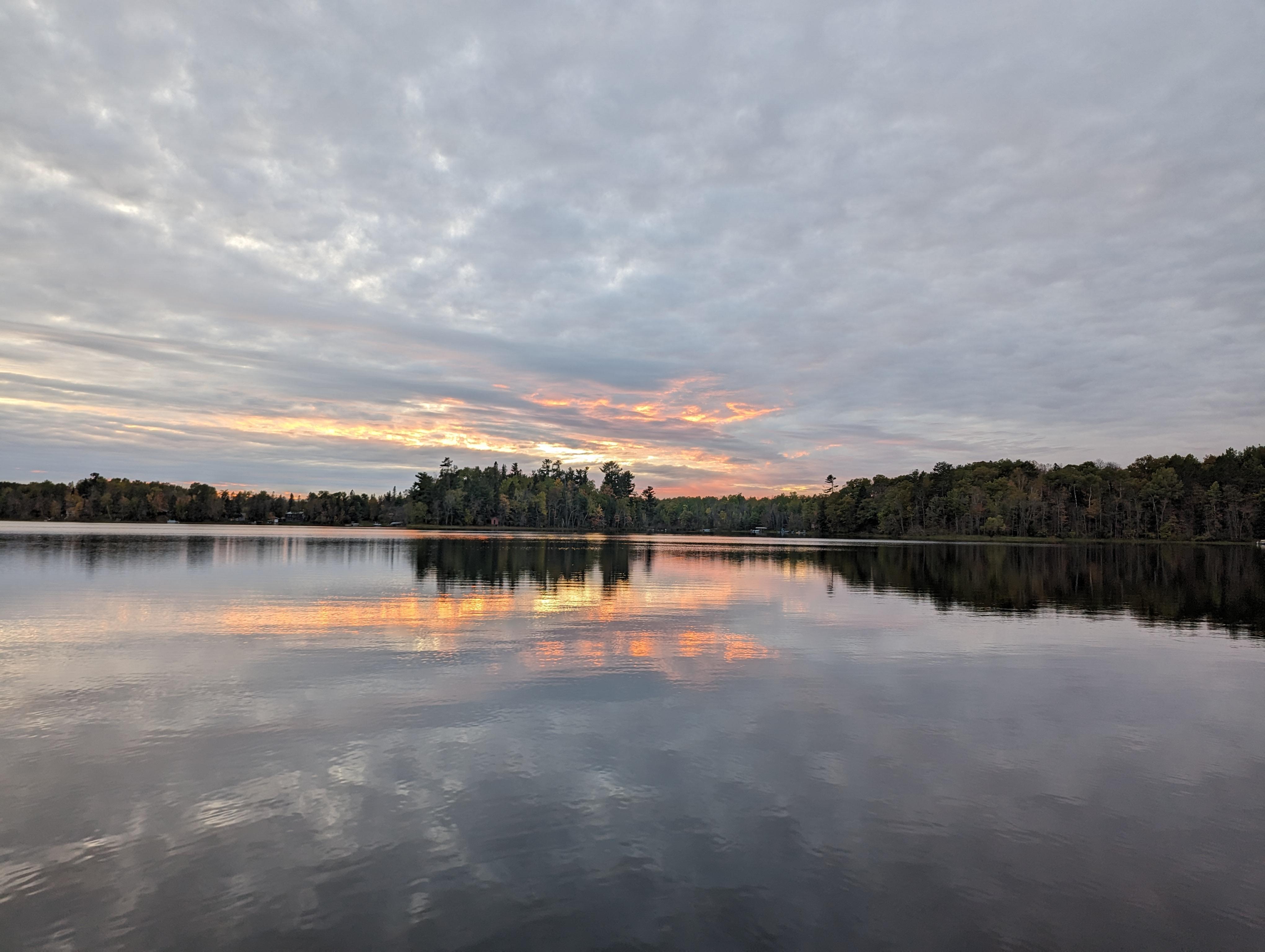 View of the lake at sunset from the beach