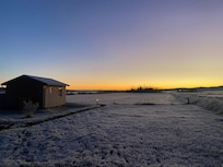 One cottage against a beautiful sunrise