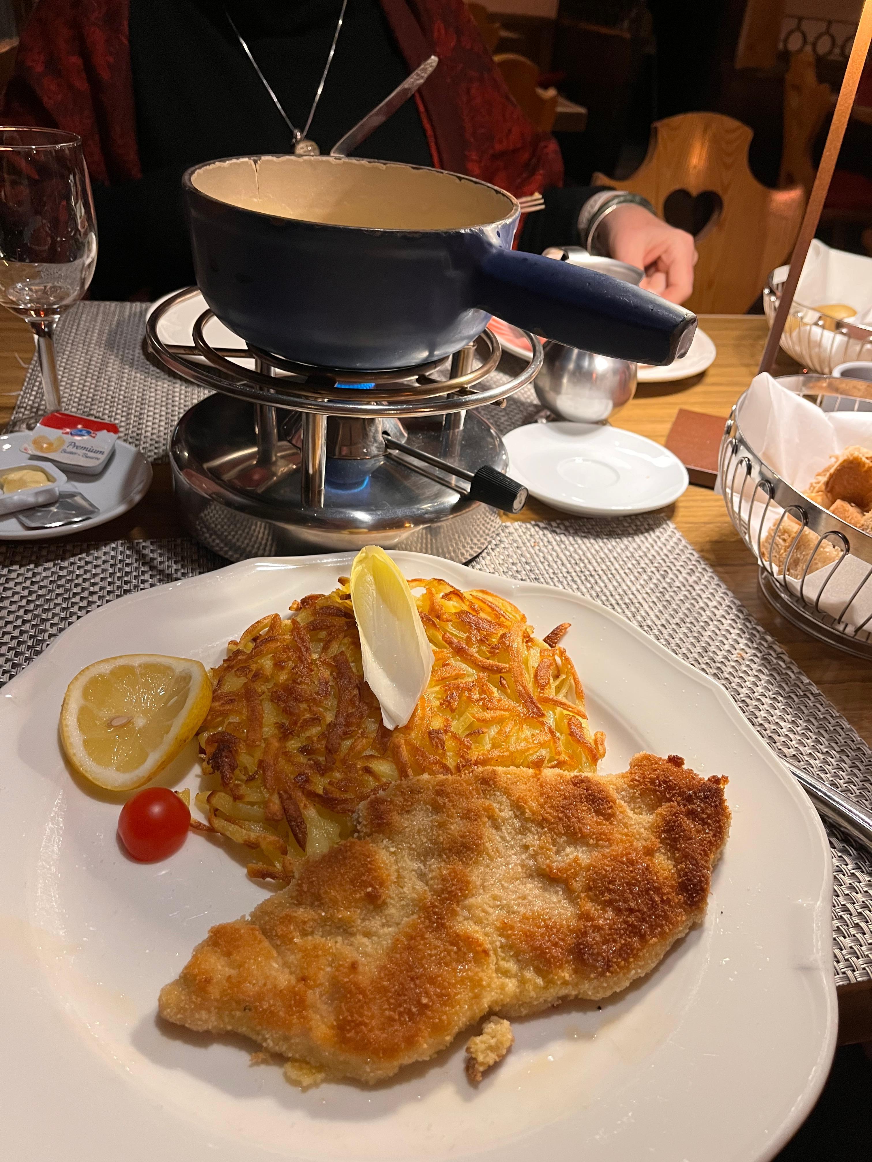 The fondue was delightful and the schnitzel was tasty.  The house beer is good as well.