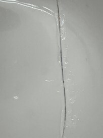 Sealant patching sink crack