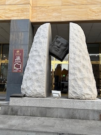Sculpture outside entrance of hotel - there steps leading up so can use the luggage ramp to roll your luggage up to the door.