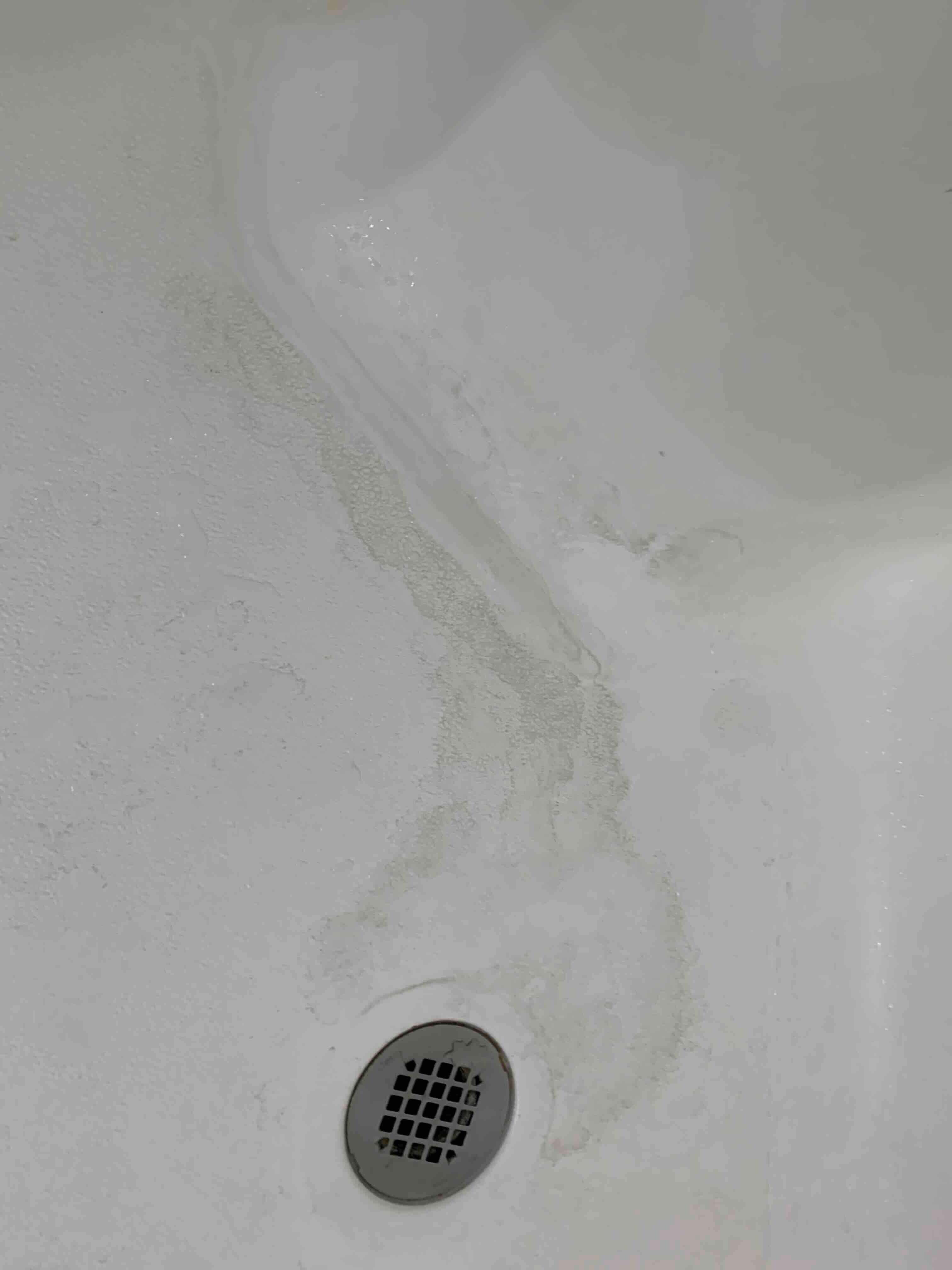 Filthy bathroom, shower, no way to get water from bottom