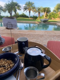 Poolside breakfast. Great place to start your day. Water falls from pool are soothing. Birds are chirping and singing.