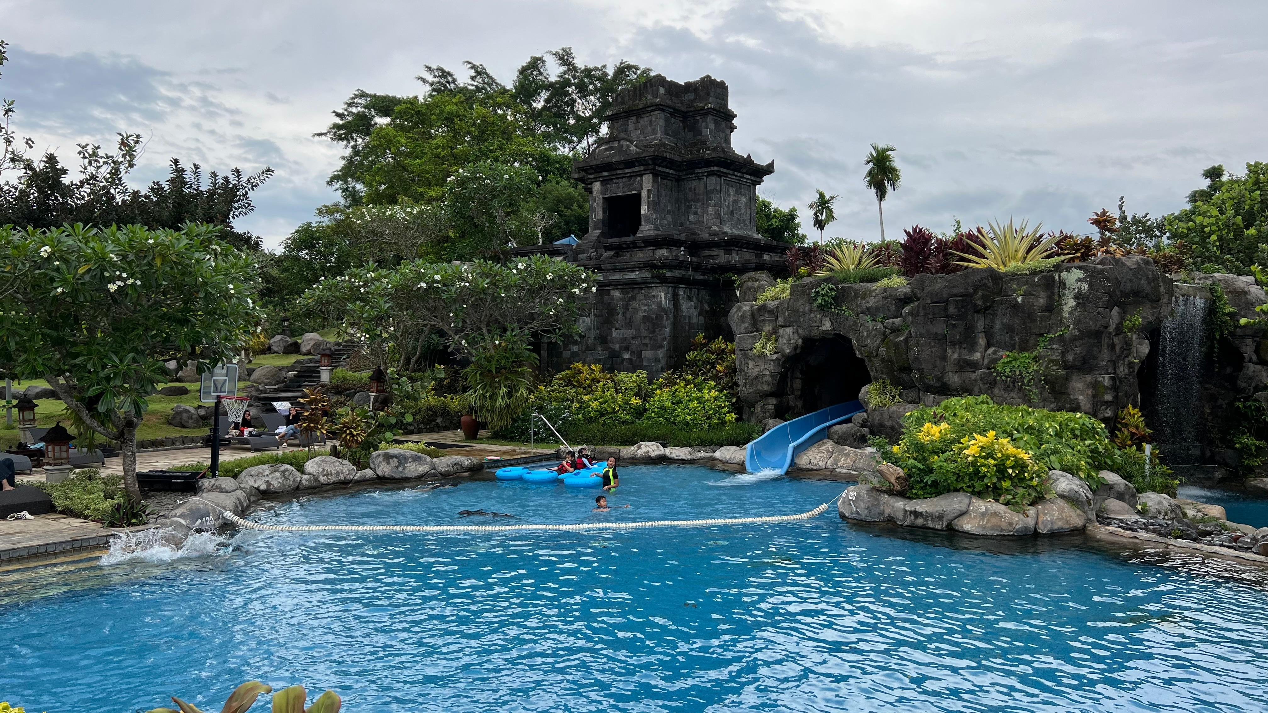 One of the pool areas and water slide 