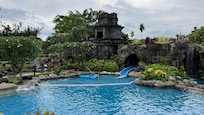 One of the pool areas and water slide