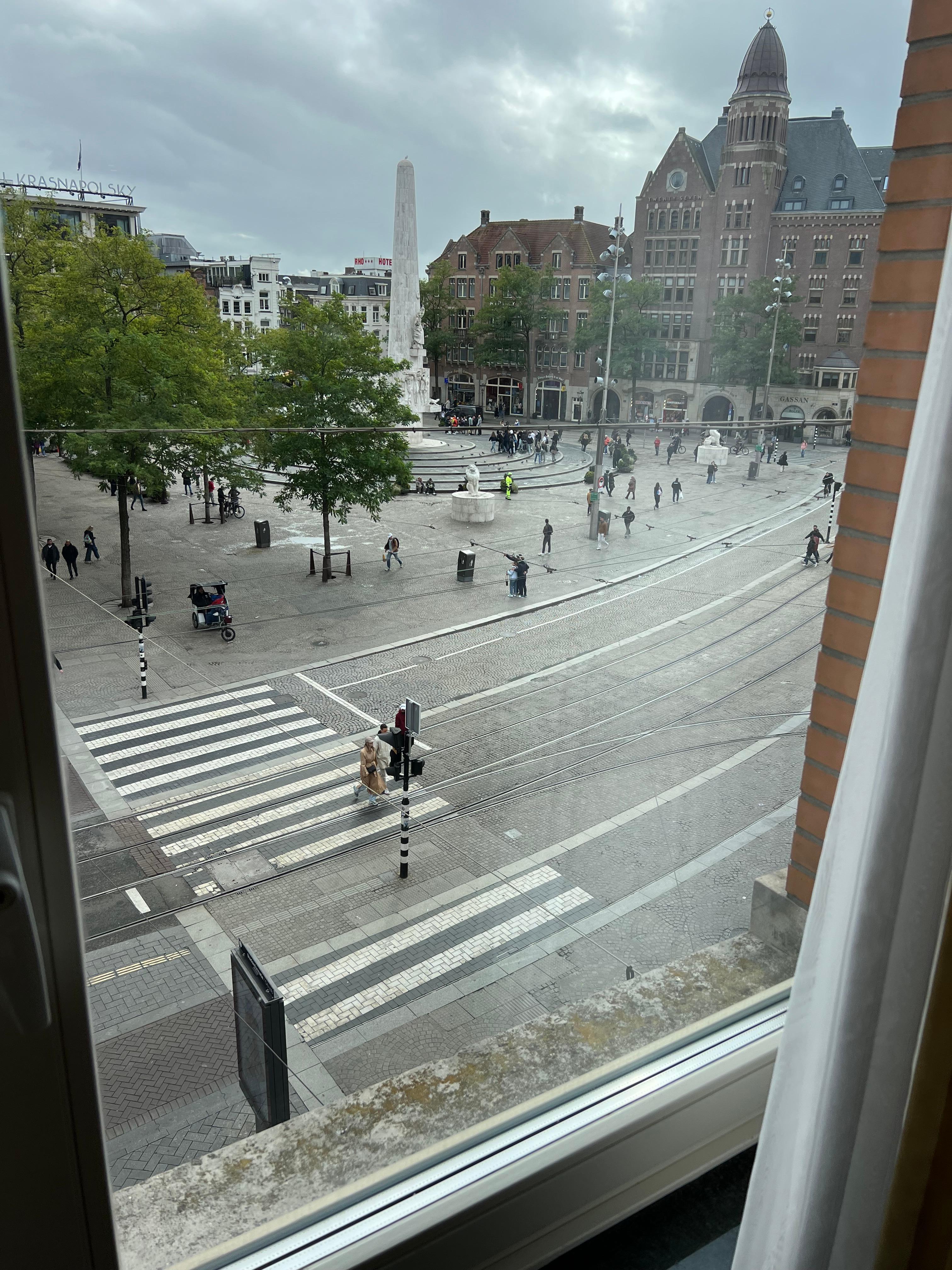 View of the Dam with a comfortable chair where I could put my feet up on the sill, sip a wine, and enjoy the bustle of A’dam. 