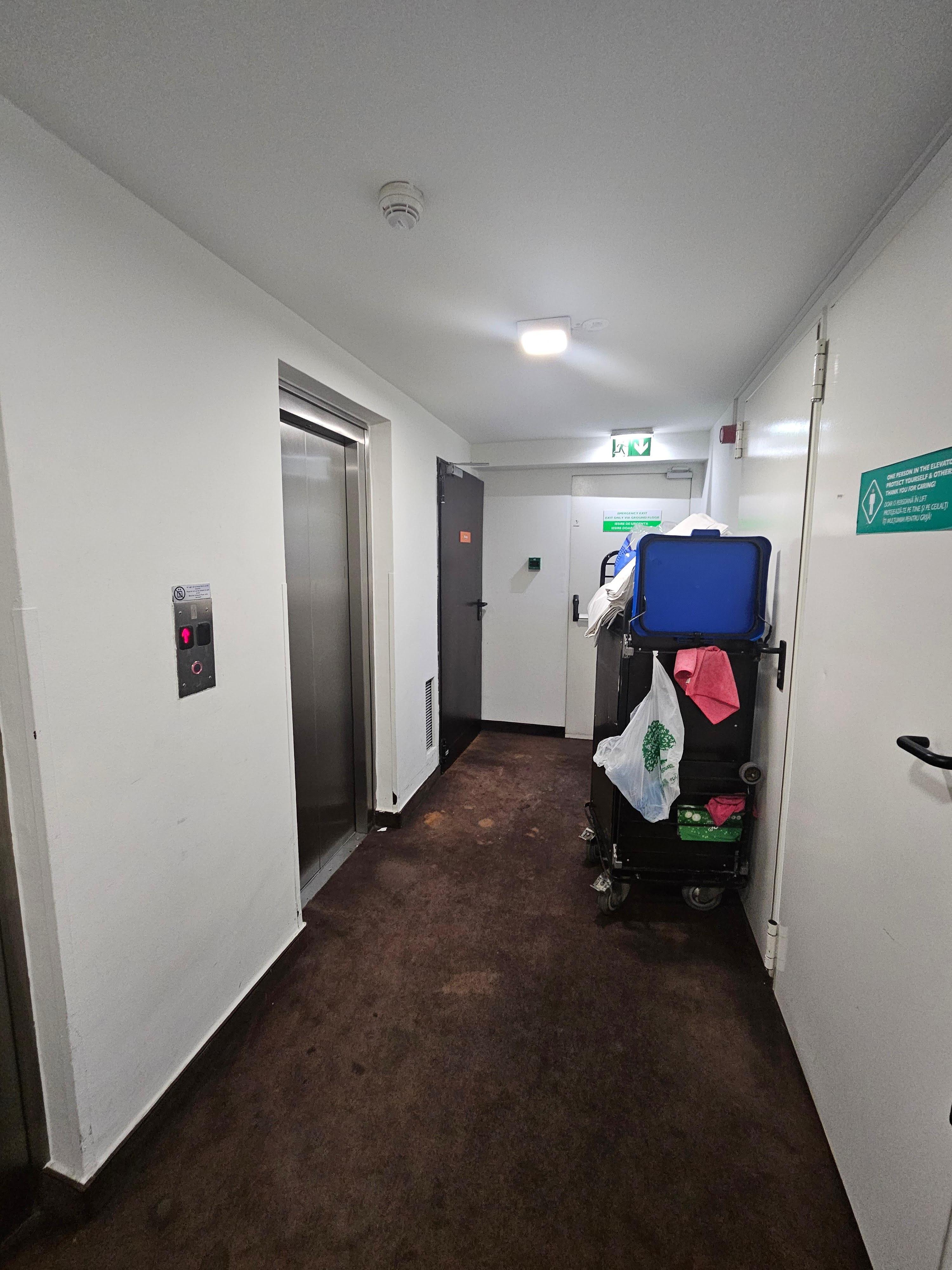 As you exit the elevator, you'll be greeted by the service trolley or cleaning products/garbage