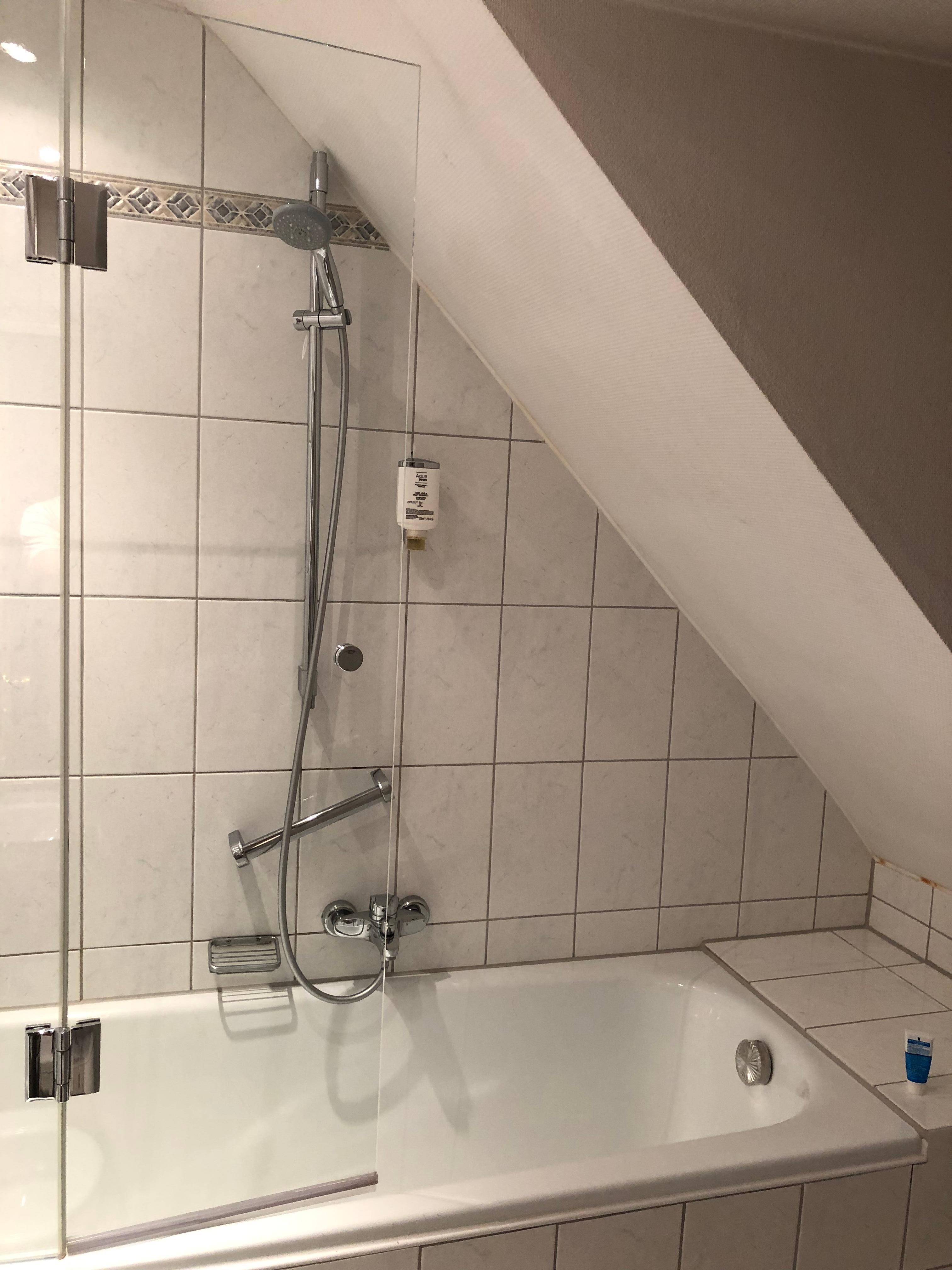 Shower should not in here, but inside.  Too easy to hit the head.  