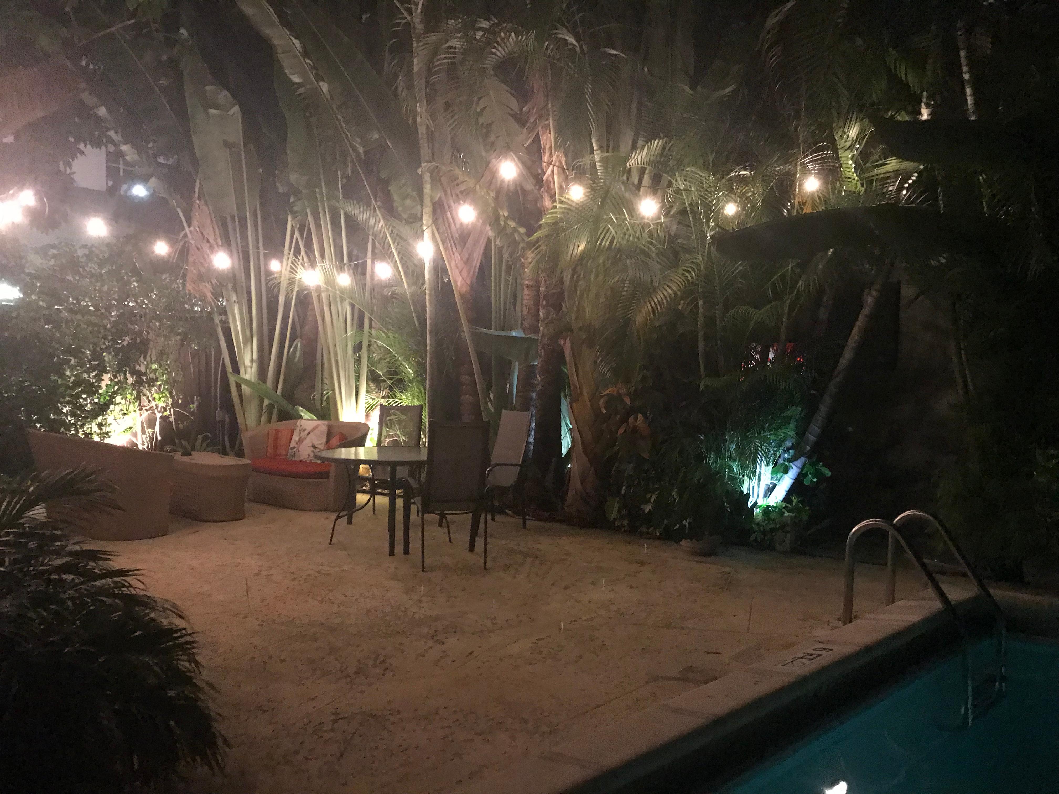 Sitting area by pool at night