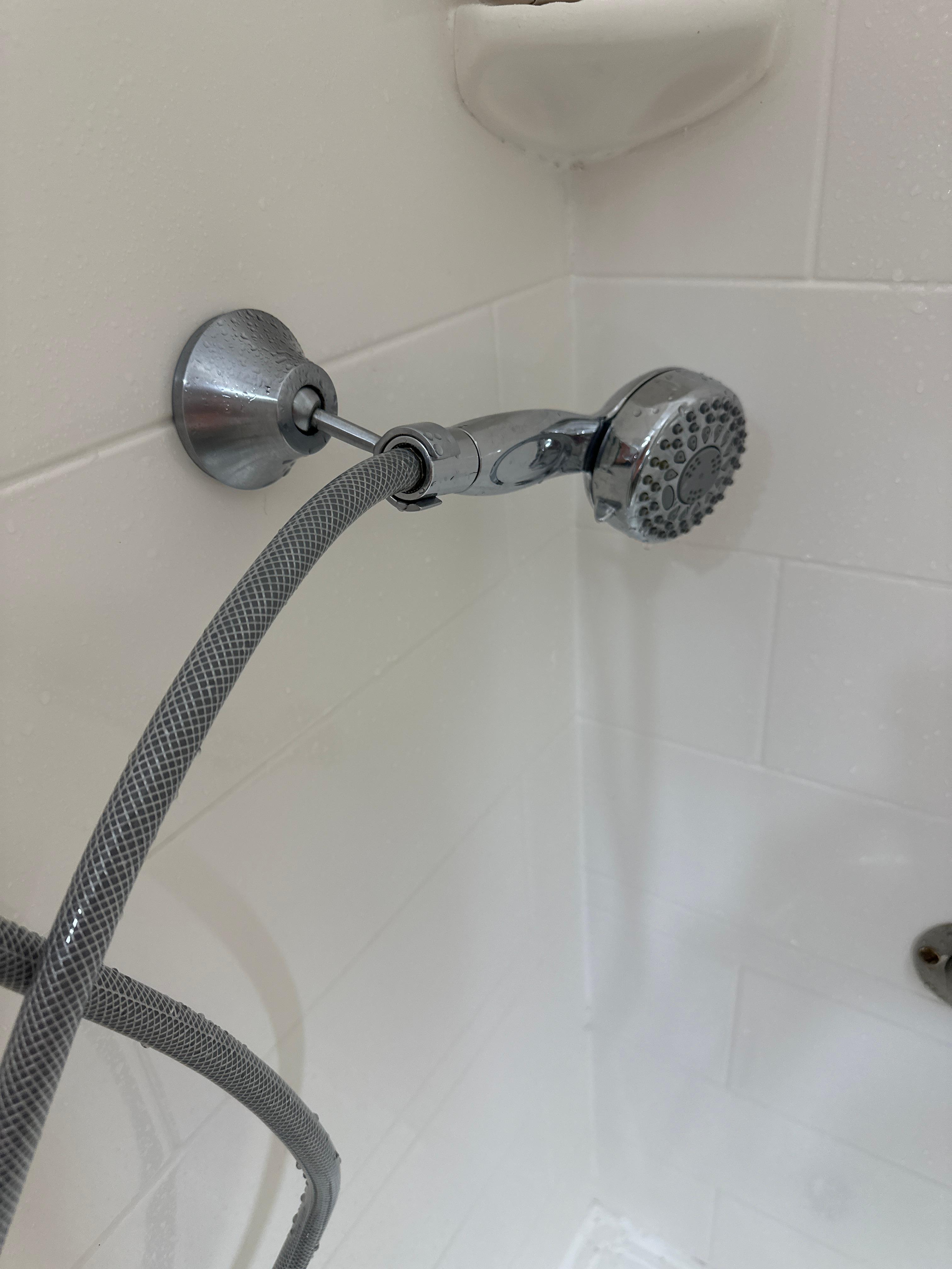 Shower head holder should be tightened so the shower head is fixed in the upright position.