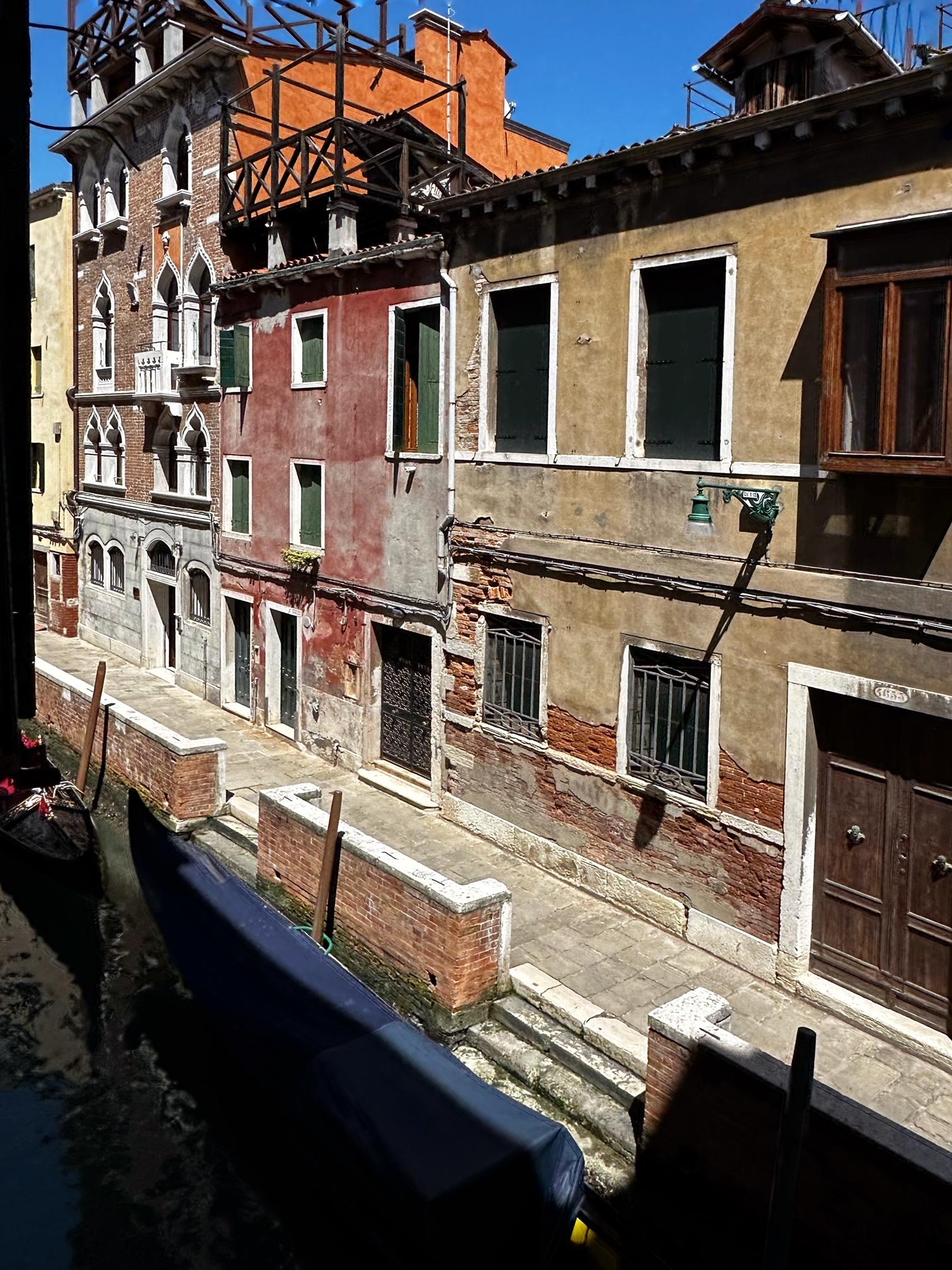 Overlooking a narrow canal with gondolas