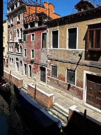Overlooking a narrow canal with gondolas
