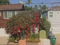 view from back window across Cedar St (alley)