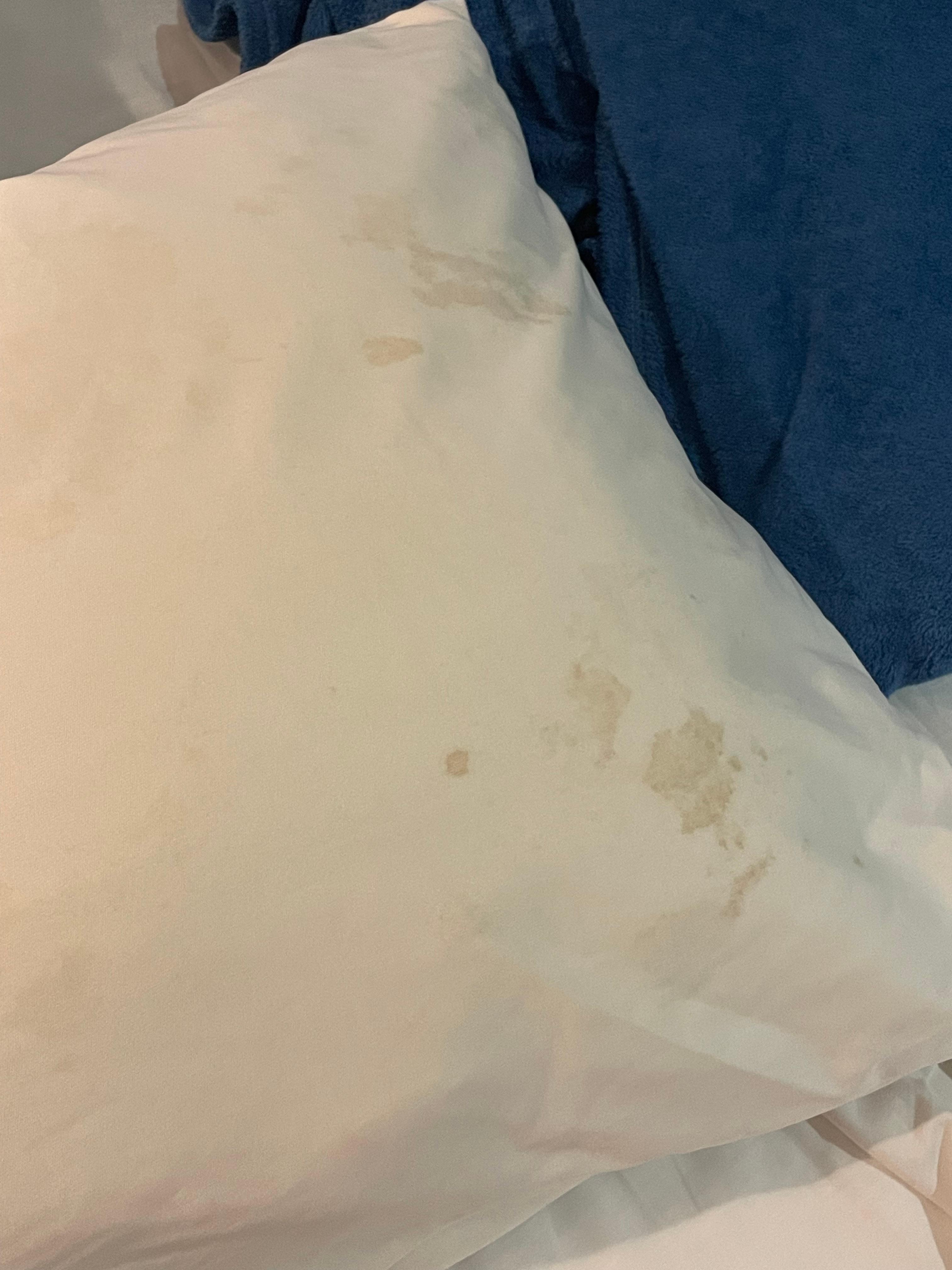 Stained pillow smells bad, dried blood