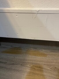 Brown liquid leaking through wall