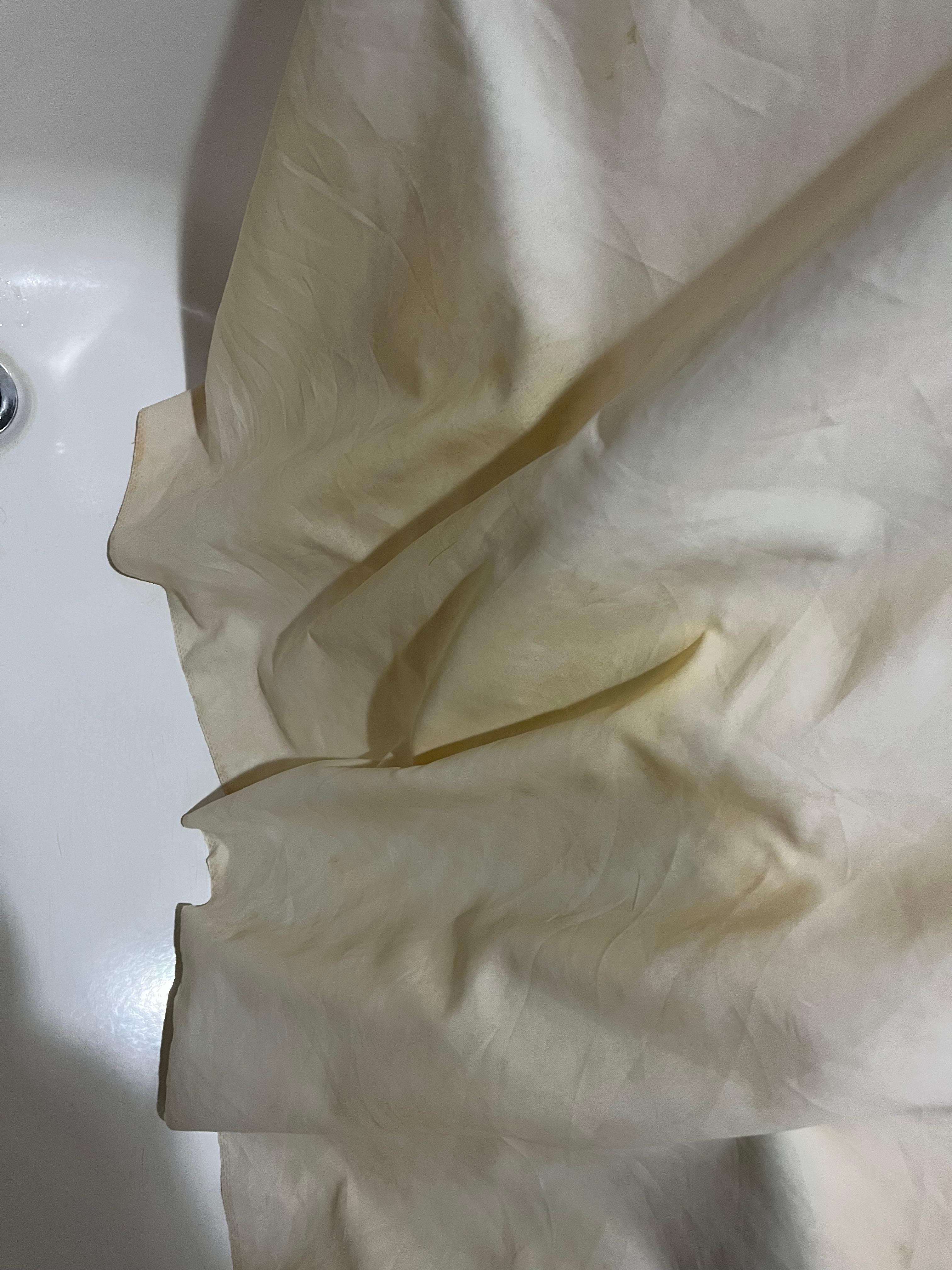 Bottom of shower curtain had a huge yellow stain.