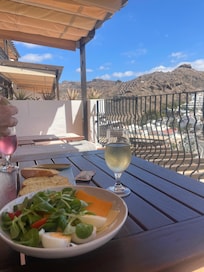Enjoy lunch and a glass of wine from our balcony