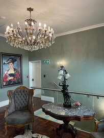 Beautiful chandelier welcomes guests to the First Floor