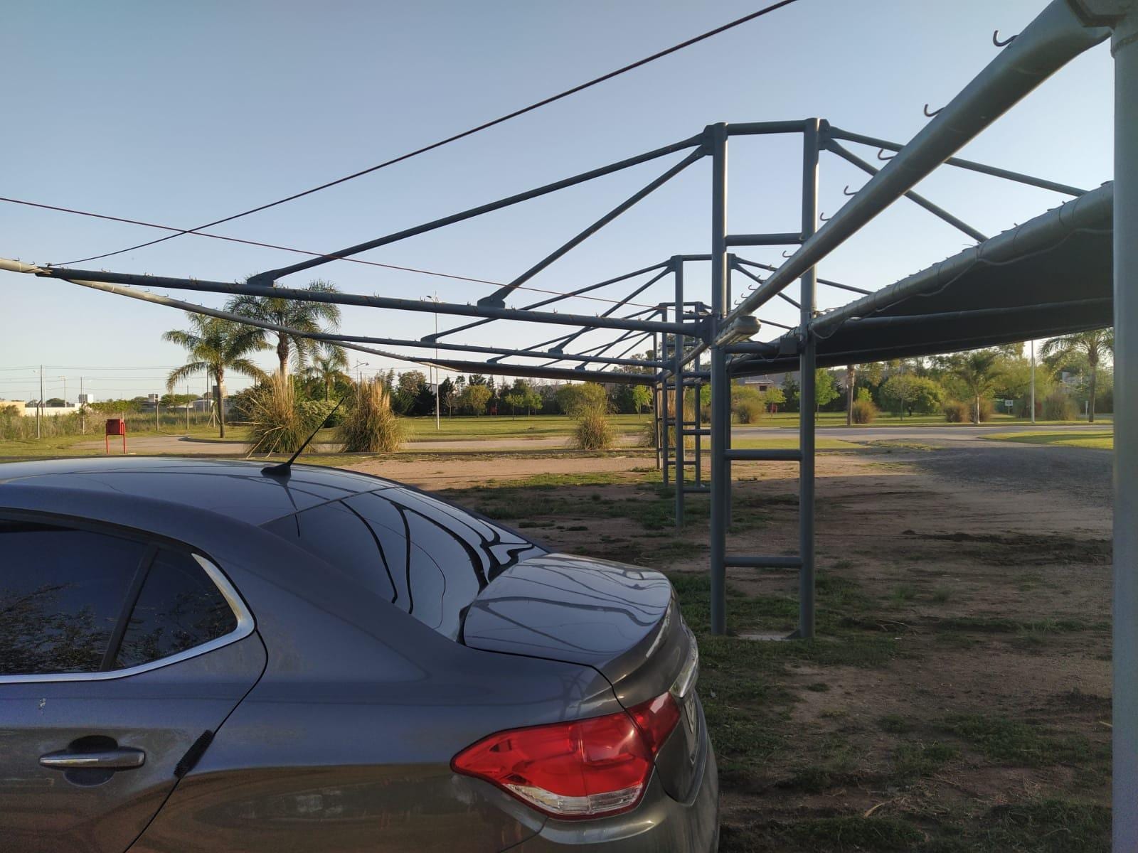 Toldos rotos de cocheras semi cubiertas