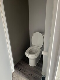 Your knees nearly touch the door