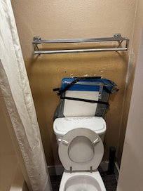 Broken toilet/hole in wall