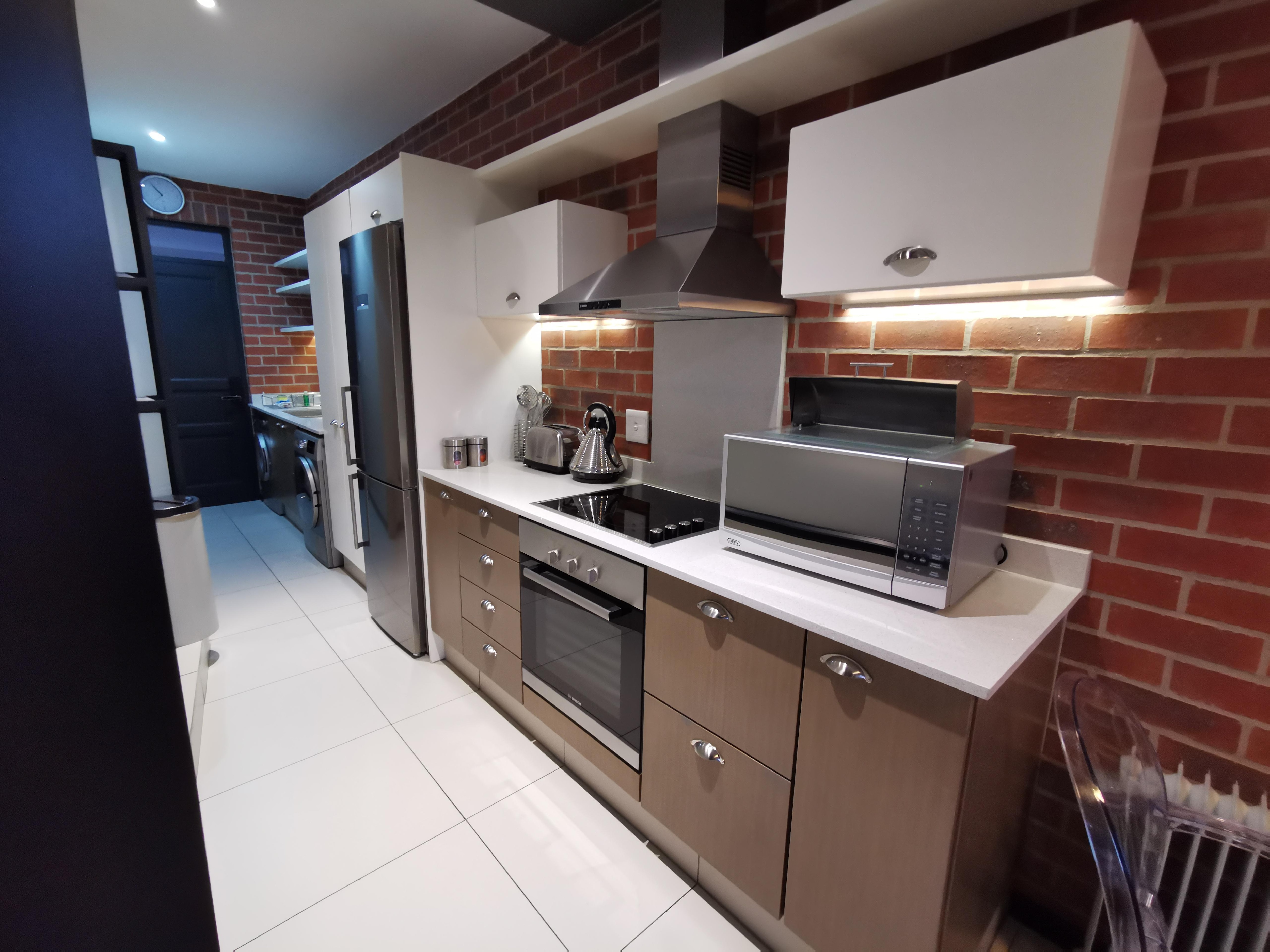 Full kitchen with washer and dryer