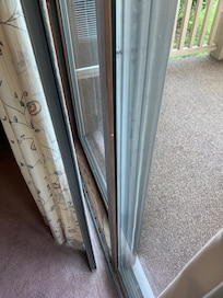 Screen door out of track; leaning