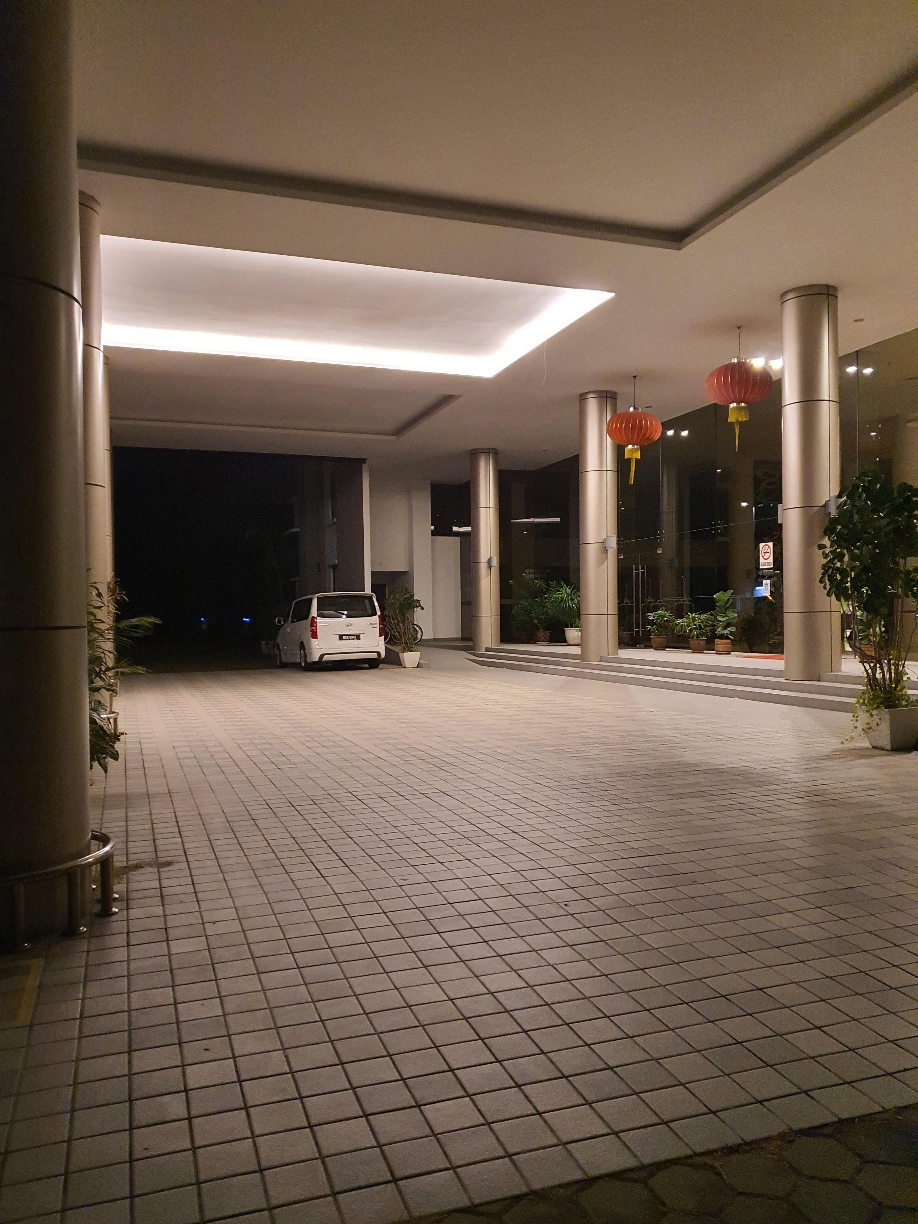 Gloomy lobby with one security guard on duty