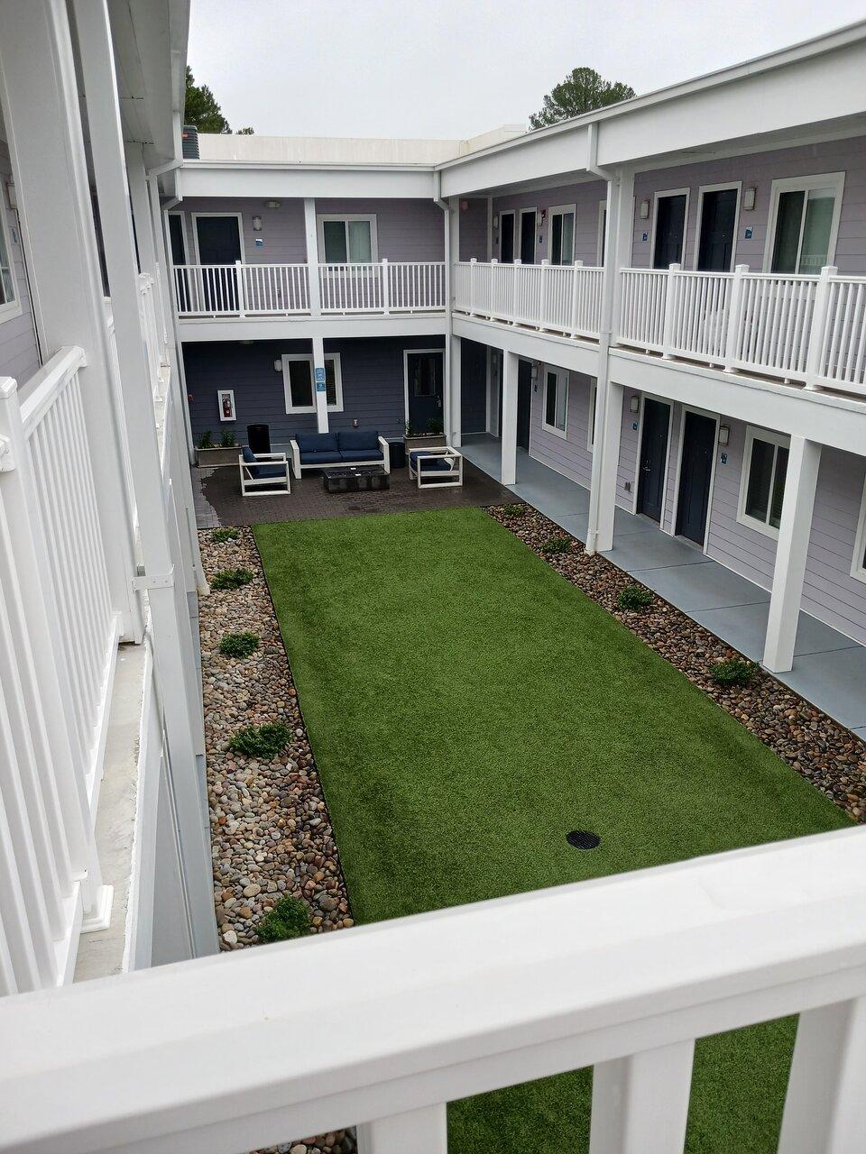 one side of inside courtyard with BBQ grill