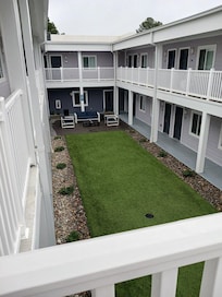 one side of inside courtyard with BBQ grill