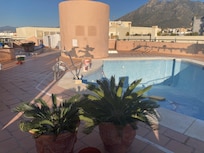 Roof terrace with pool, sunbeds and bar