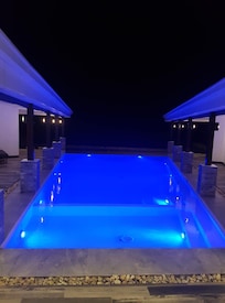 Evening its lights in the pool make it cozy, it changes colors. Its also nice.