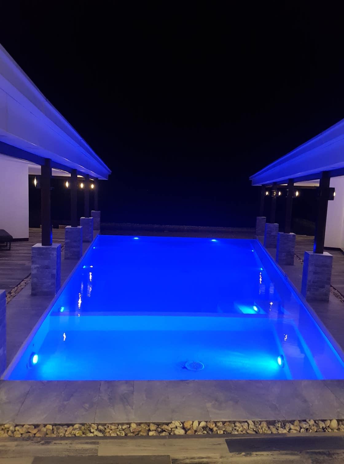 Evening its lights in the pool make it cozy, it changes colors.  Its also nice.  