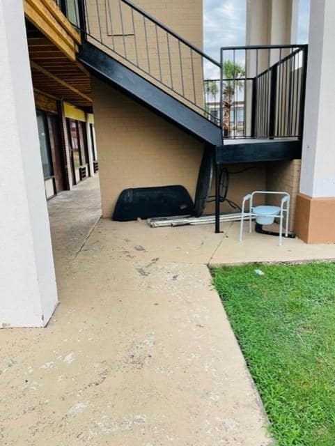 Portable toilet under the stairs outside.