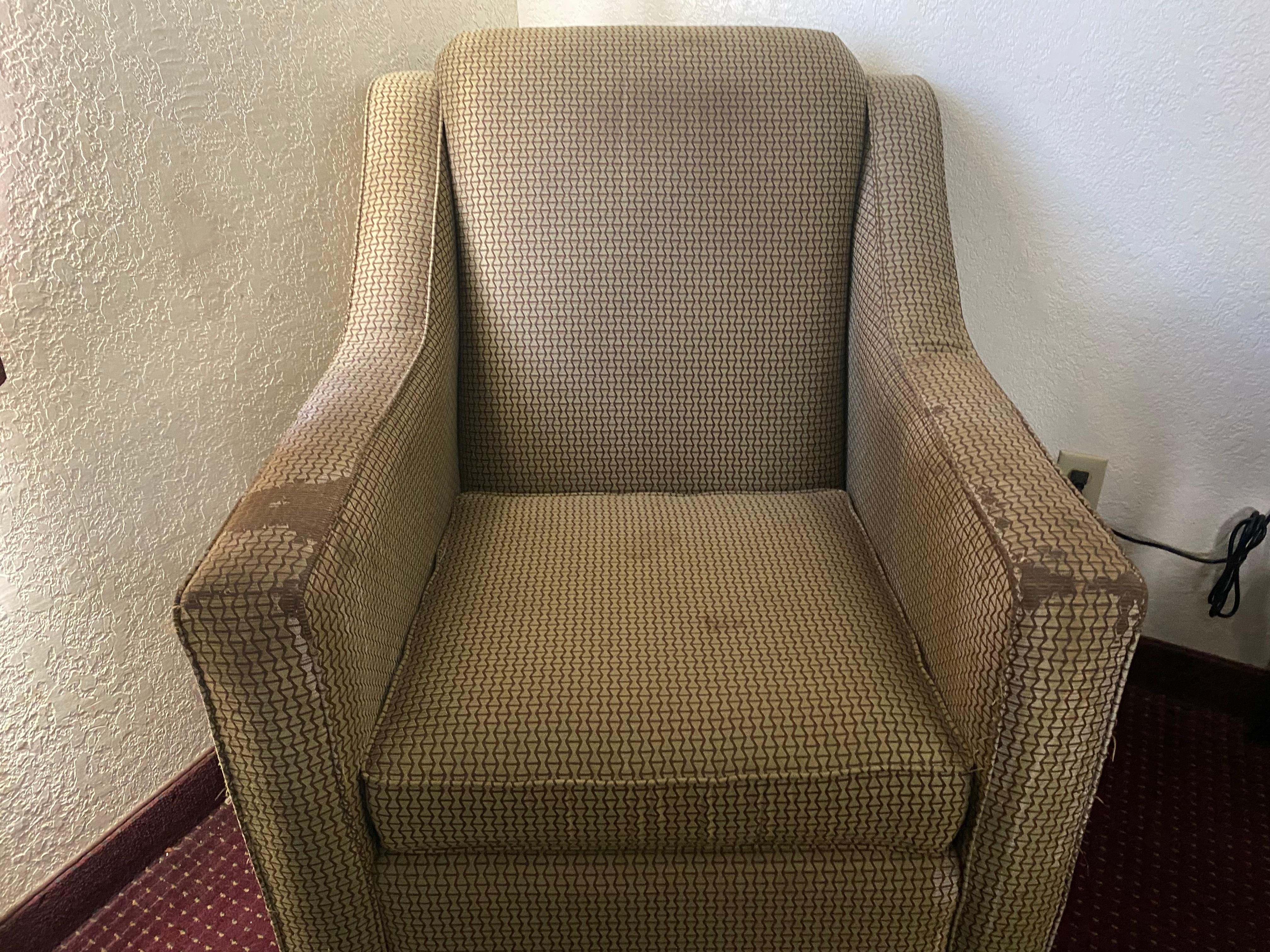 A chair in the room covered with stains. I do not believe Goodwill would accept it.