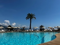 Peacefully seated around the pool with excellent service of drinks and fresh towels and adjustments to our umbrellas