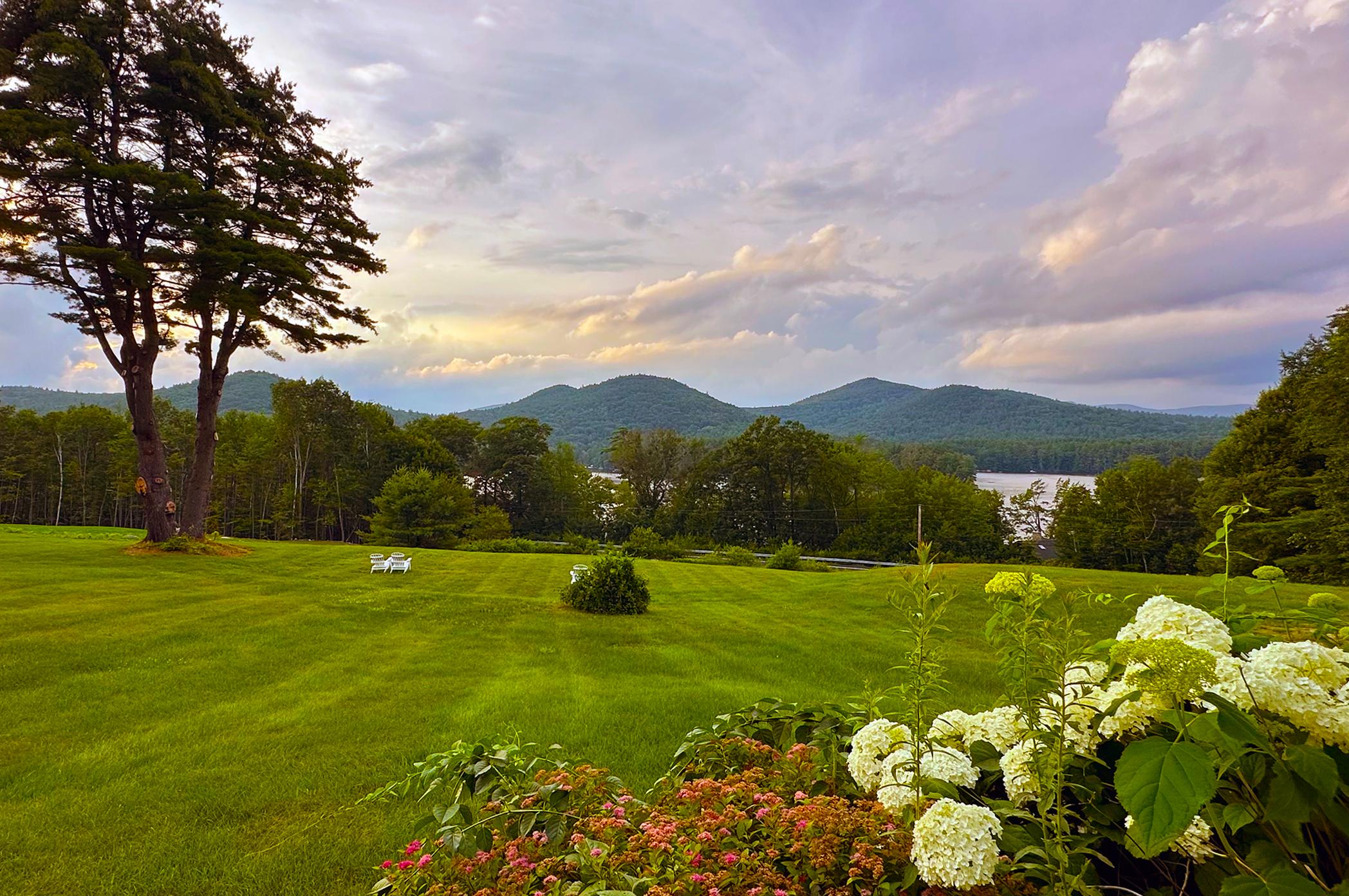 View of Squam Lake from our suite's deck facing the front lawn at the Manor on Golden Pond